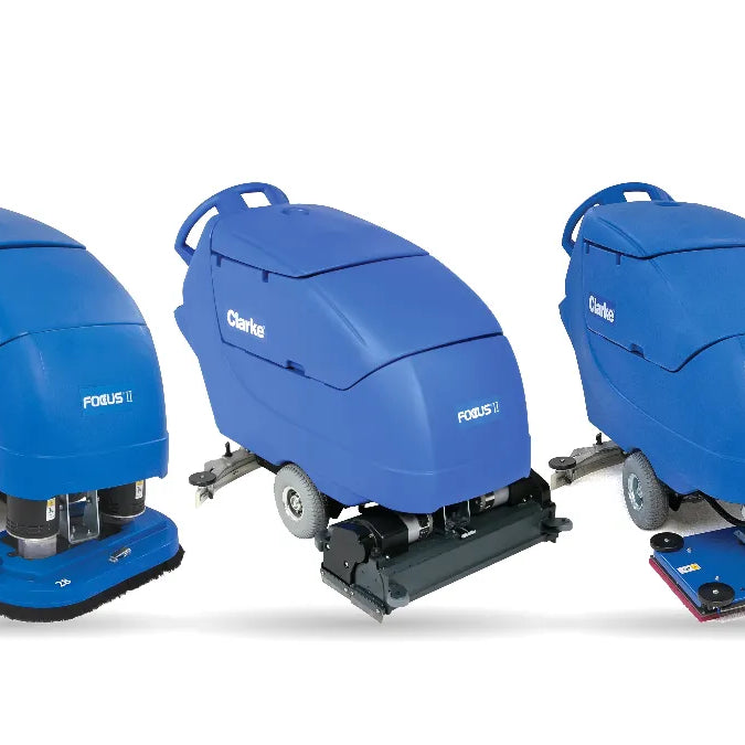 Clarke Focus II disc, cylindrical and BOOST orbital walk-behind floor scrubbers side by side