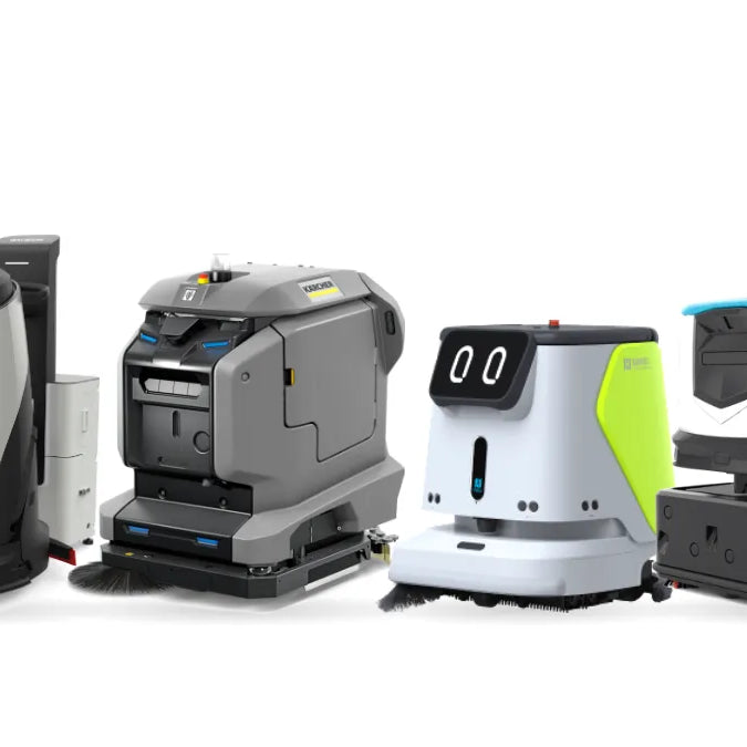 Gausium Scrubber 50 at its workstation, Kärcher KIRA robotic scrubber, Pudu CC1 and ICE Cobi 18 robotic floor scrubbers side by side