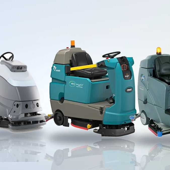 ICE Cobi 18 and Nilfisk Liberty SC50 robotic floor scrubbers beside a Tennant T7AMR robotic rider and an ICE RS26+ ride-on floor scrubber