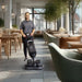 NaceCare 440NX Ultra-Compact Scrubber Trolley in use cleaning restaurant floor