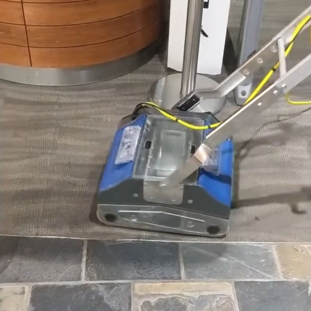The Numatic Duplex 420 CRB Multiwash Scrubber in use on carpet