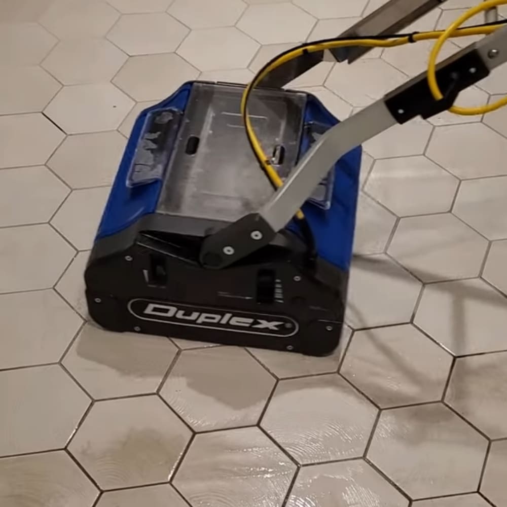 NaceCare Duplex 420 CRB Multiwash Scrubber in use on tile and grout floors