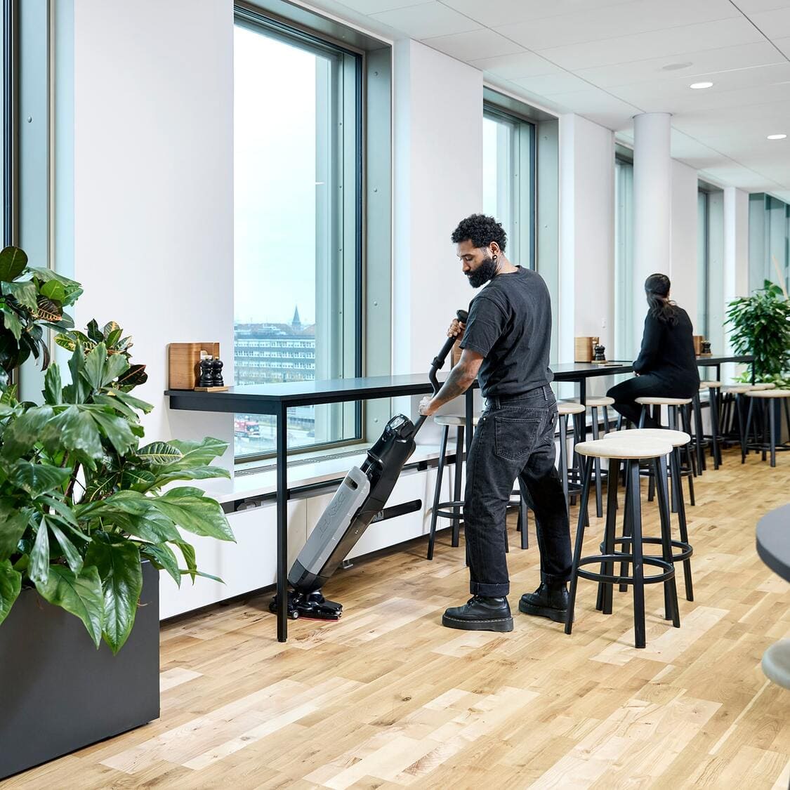 Nilfisk Dryft Scrubber in use in cafeteria by janitor or custodian staff