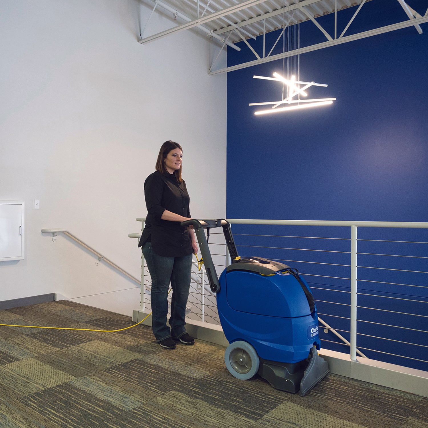 Nilfisk Clarke EX40 16 ST Carpet Extractor in Use By Operator on Carpet, Office or Hallway Stairs Area