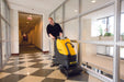 Tornado BR 18/11 Automatic Scrubber In Use by Operator in a Hallway Space
