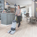 Scrubbing a cafe floor with the Advance SC100