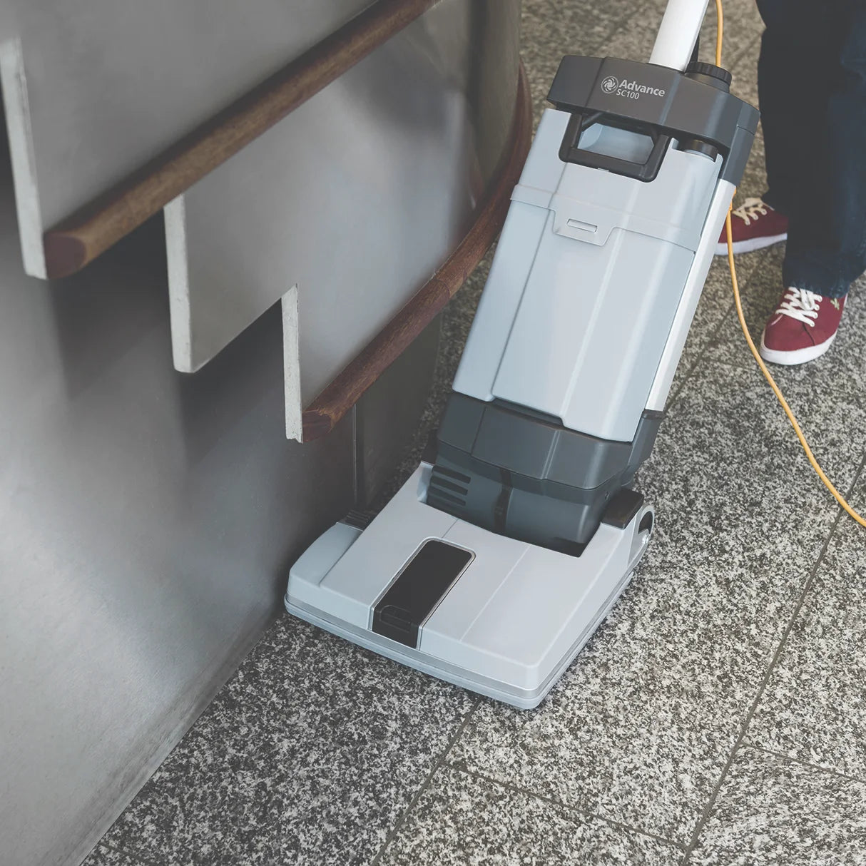 SC100 cleaning along a wall and stair edge