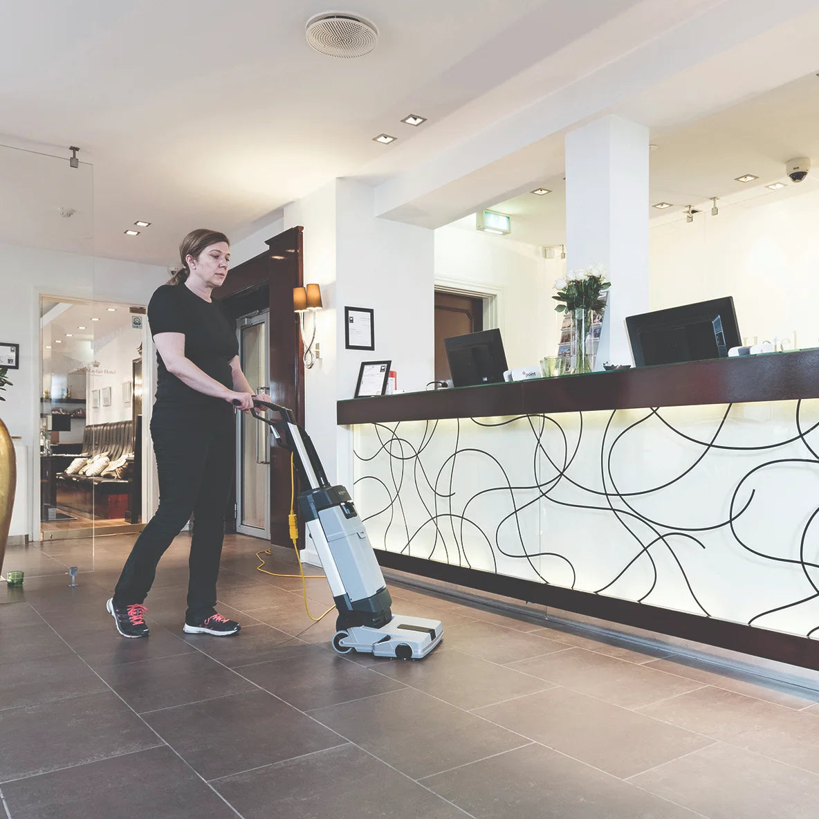 Cleaning a hotel lobby floor with the SC100
