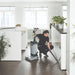 Cleaning under an office counter with the SC100 manual suction hose