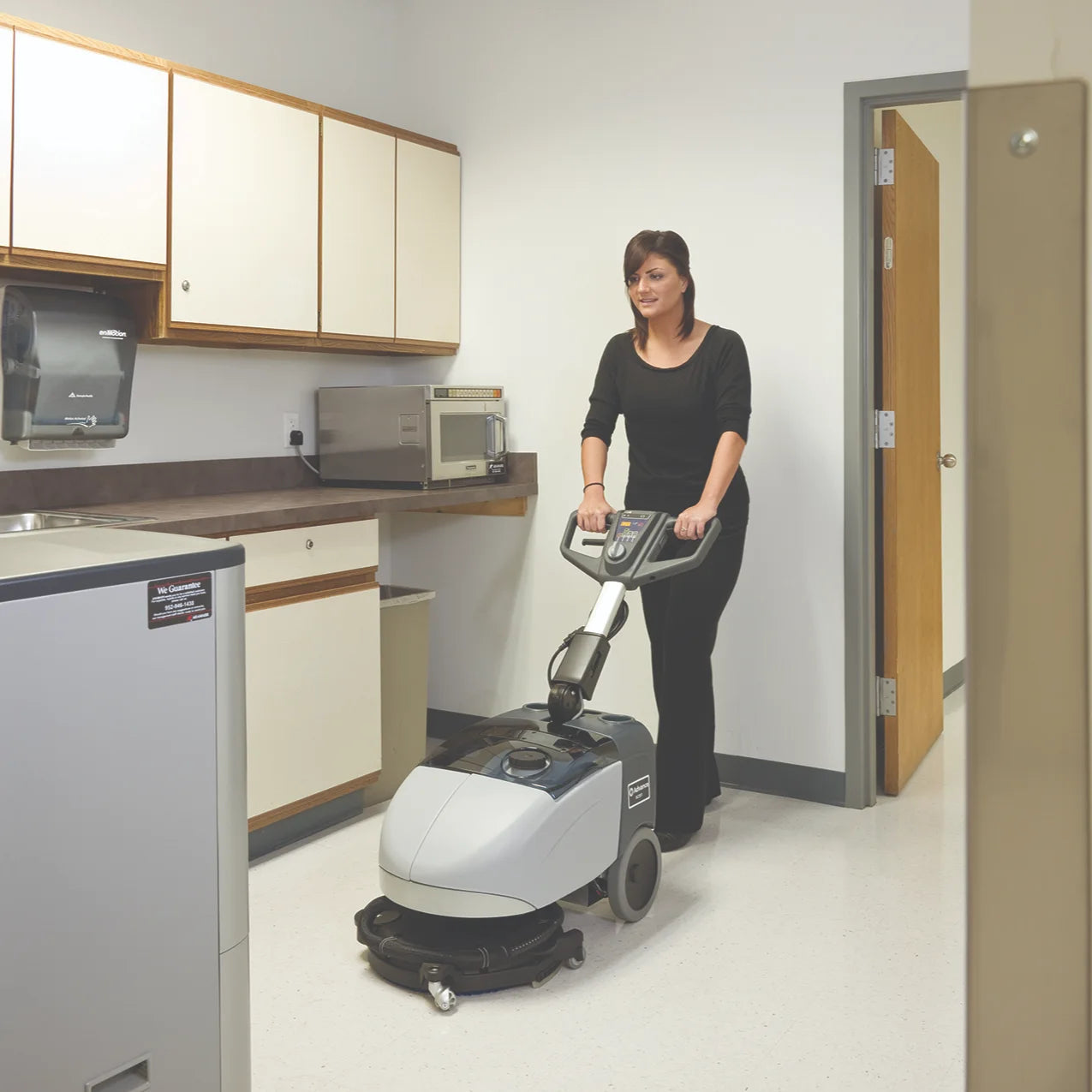 Cleaning a break room floor with the SC351