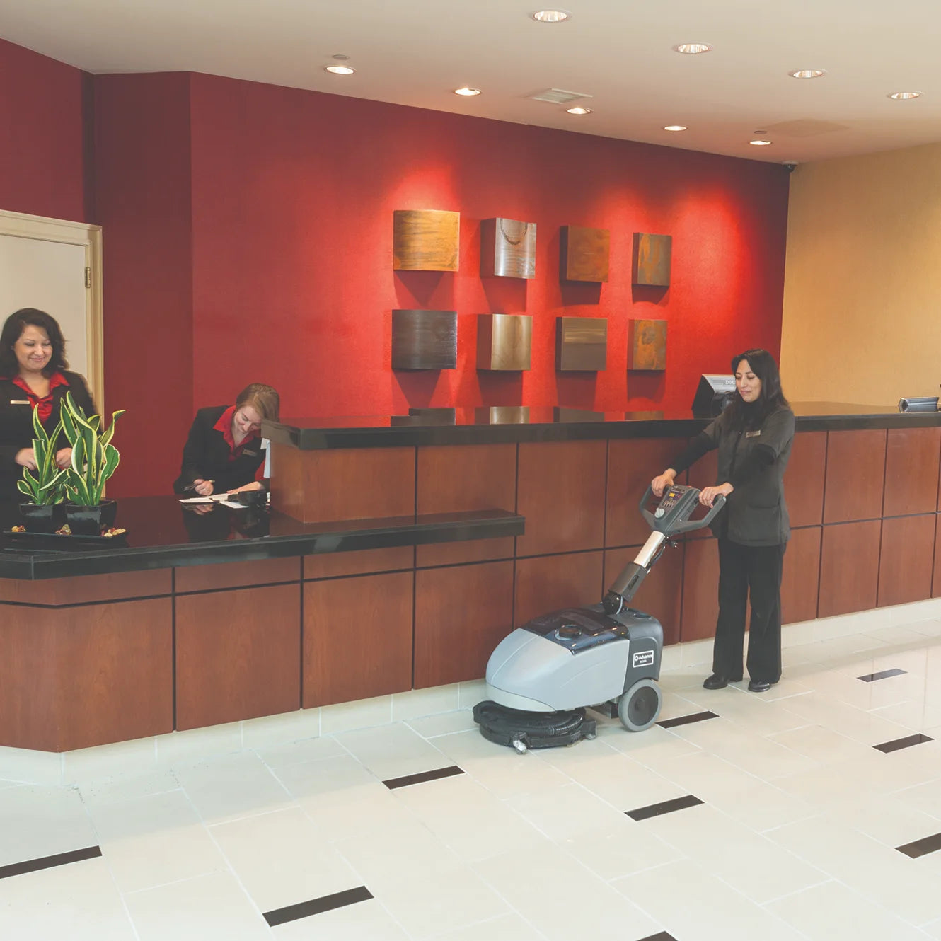 Scrubbing a hotel lobby floor with the Advance SC351