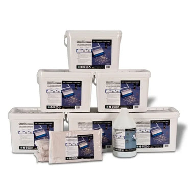 Stacked 20 lb buckets of Carpet Cleaner America dry cleaning compound with 2.2 lb bags and a prespray jug in front