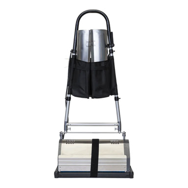 Black three-pocket CRB accessory holder strapped to the handle uprights of a CRB machine, holding the renovator trays