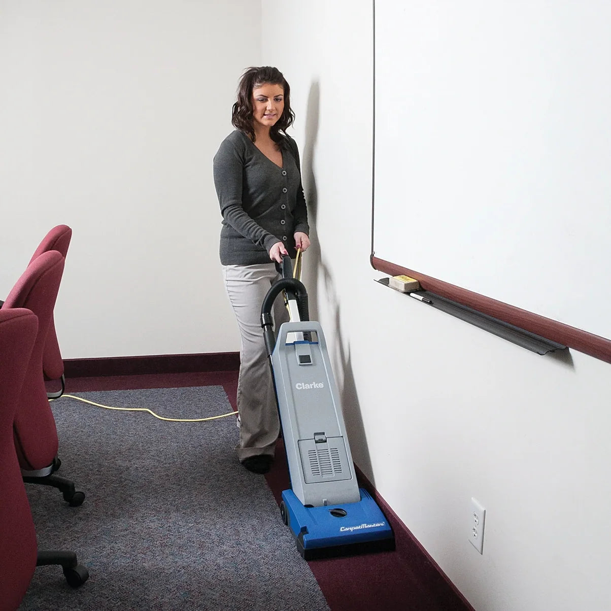 Clarke CarpetMaster 112 vacuuming the carpet edge along a wall