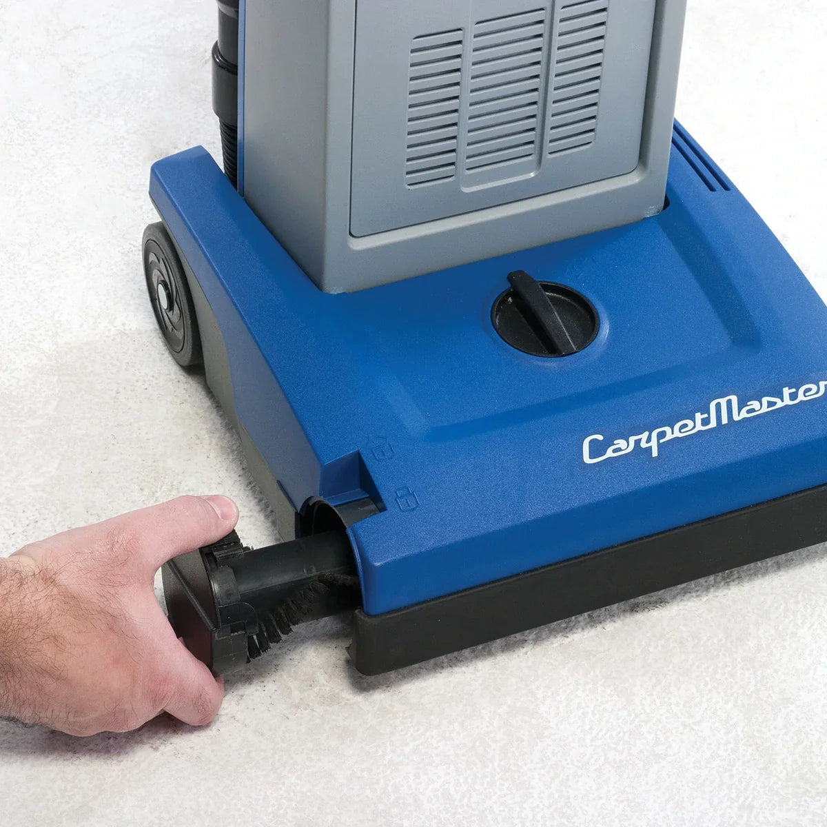 Brush roll being pulled out of the Clarke CarpetMaster 112 base without tools