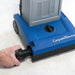 Brush roll being pulled out of the Clarke CarpetMaster 112 base without tools