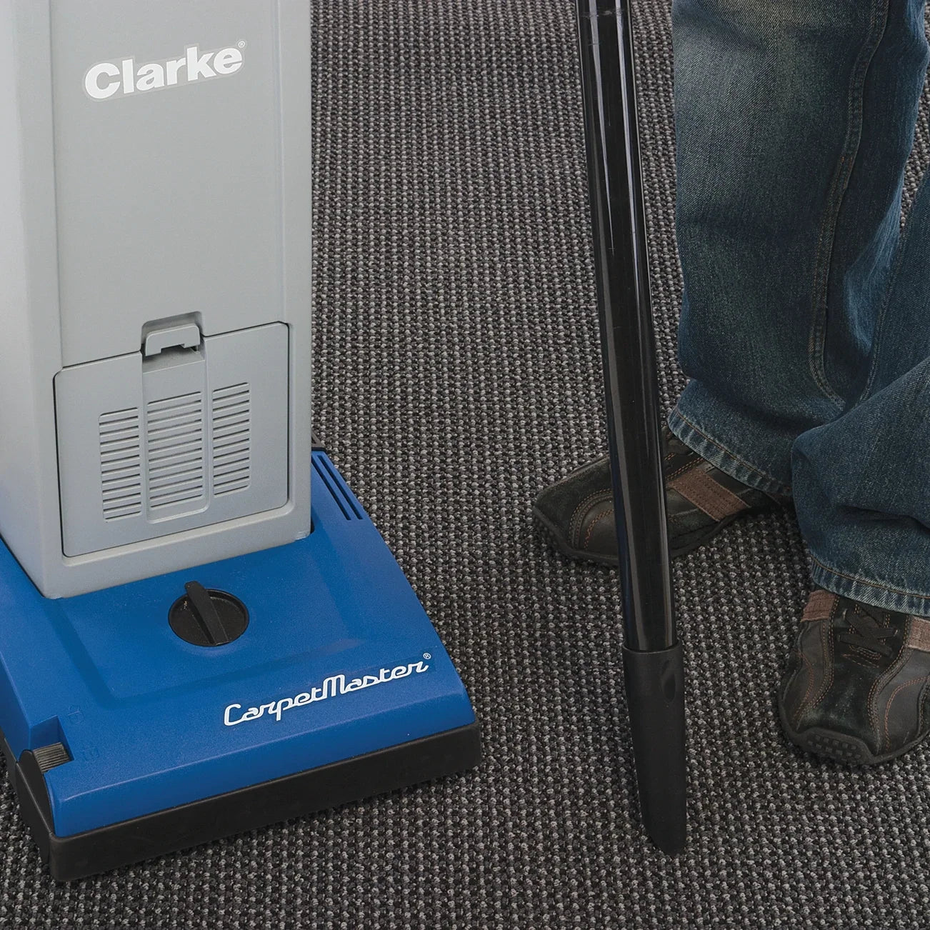 Clarke CarpetMaster 112 wand and crevice tool cleaning along a baseboard