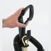Hand using the quick cord clip on the handle of a Clarke CarpetMaster upright vacuum