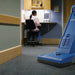 Clarke CarpetMaster 215 upright vacuum on commercial carpet beside a workstation
