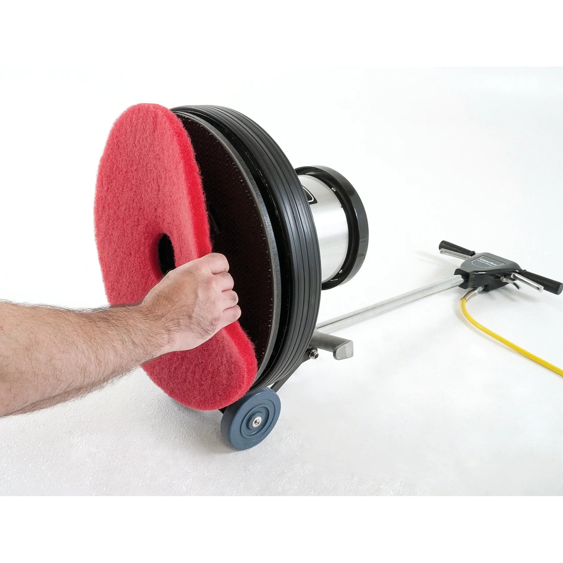 Operator removing a floor pad from the pad driver of the Clarke CFP Pro 20DS