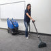 Clarke EX20 portable carpet extractor cleaning the carpet of an office training room