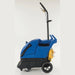 Clarke EX20 carpet extractor seen from the left side, showing the large rubber rear wheels, front roller wheels and wrapped yellow power cord