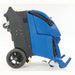 Clarke EX20 carpet extractor tipped back onto its rear wheels for moving, with the front loading wheels visible underneath