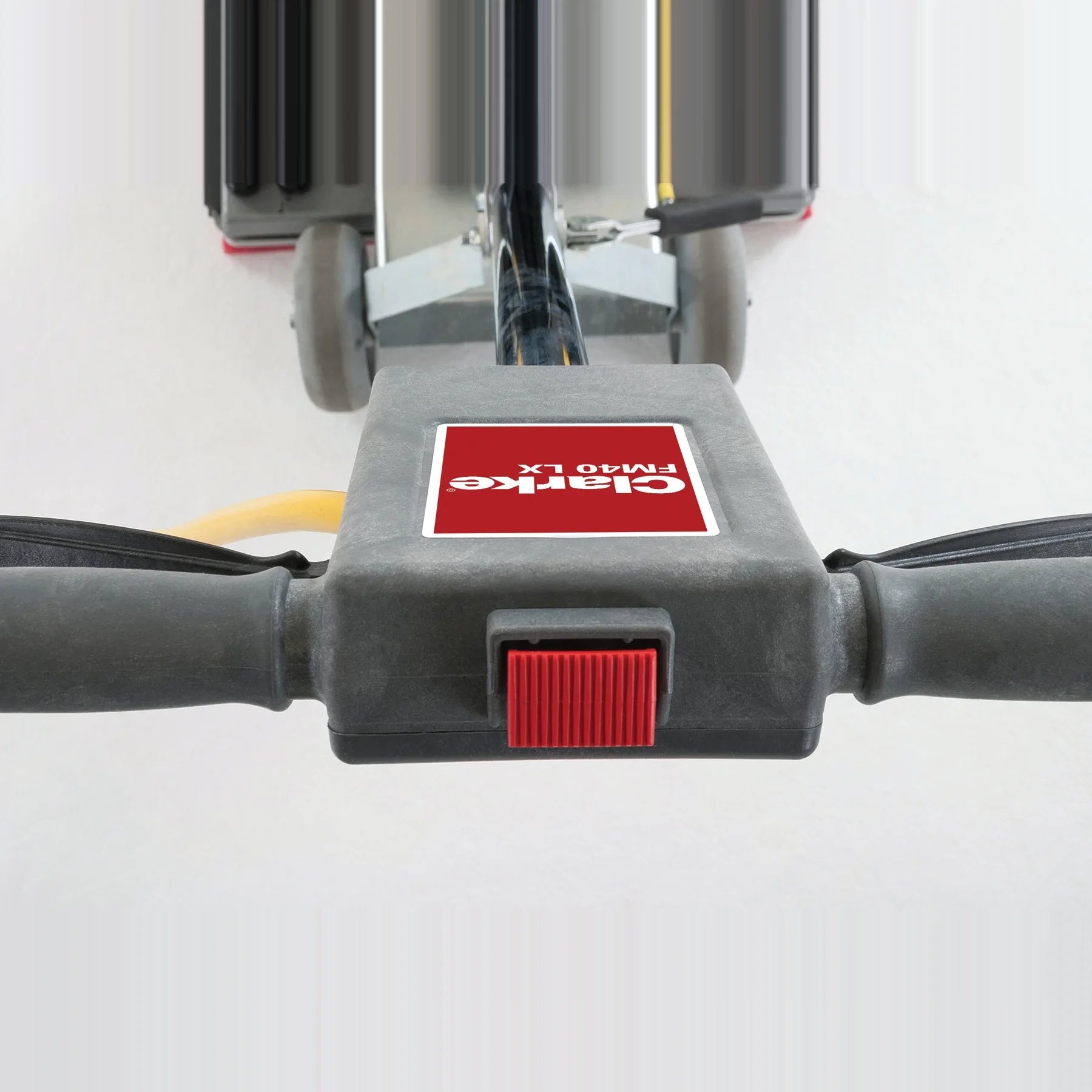 Close-up of the safety lockout switch on the Clarke FM40 LX handle
