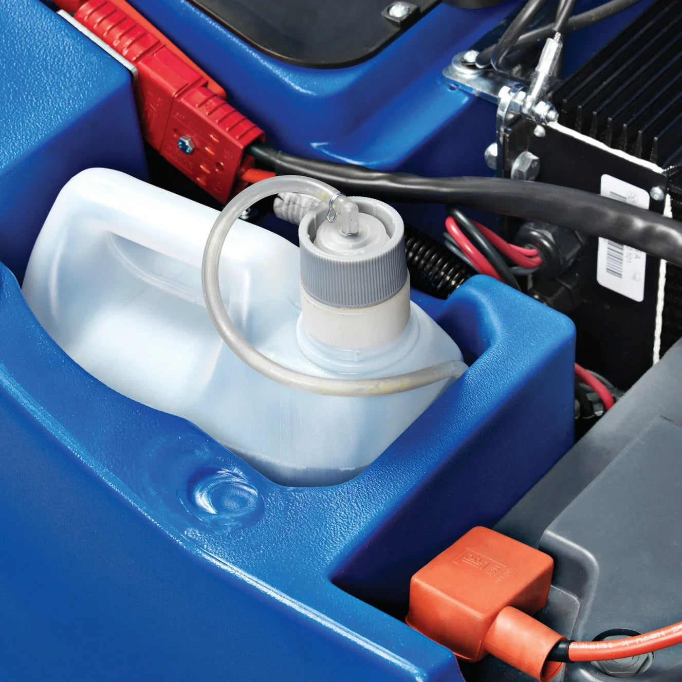 Detergent container for the optional chemical mixing system, seated in its holder inside a Clarke Focus II MicroRider