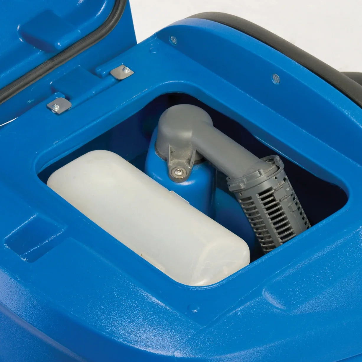 Recovery tank lid open on a Clarke Focus II MicroRider, showing the wide tank opening, the debris basket and the vacuum float housing