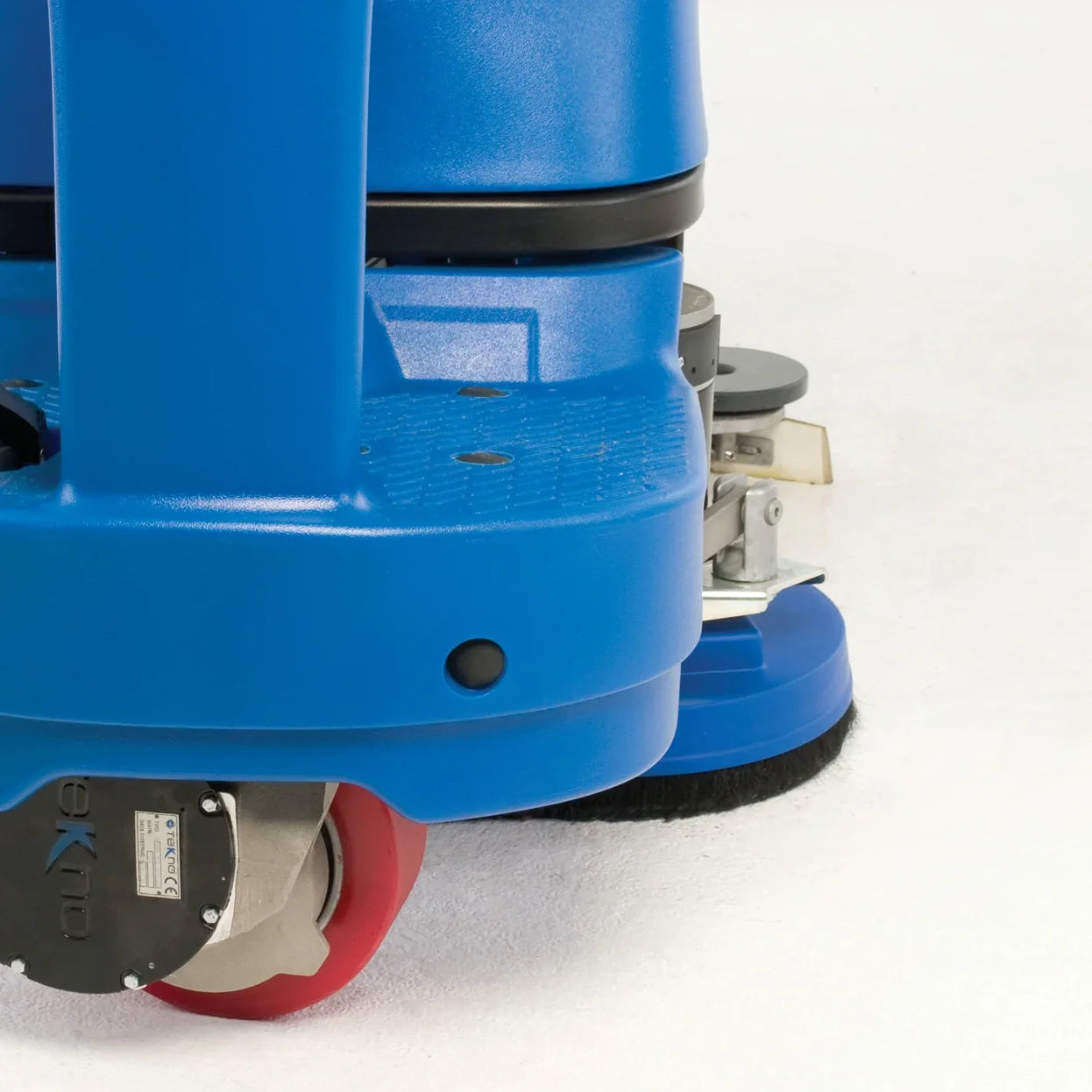 Close-up of the Clarke Focus II MicroRider front wheel and SafetyGlide disc deck swung out to the side during a turn