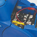 Battery compartment of the Clarke Focus II Rider under the raised seat, with the battery pack and cables