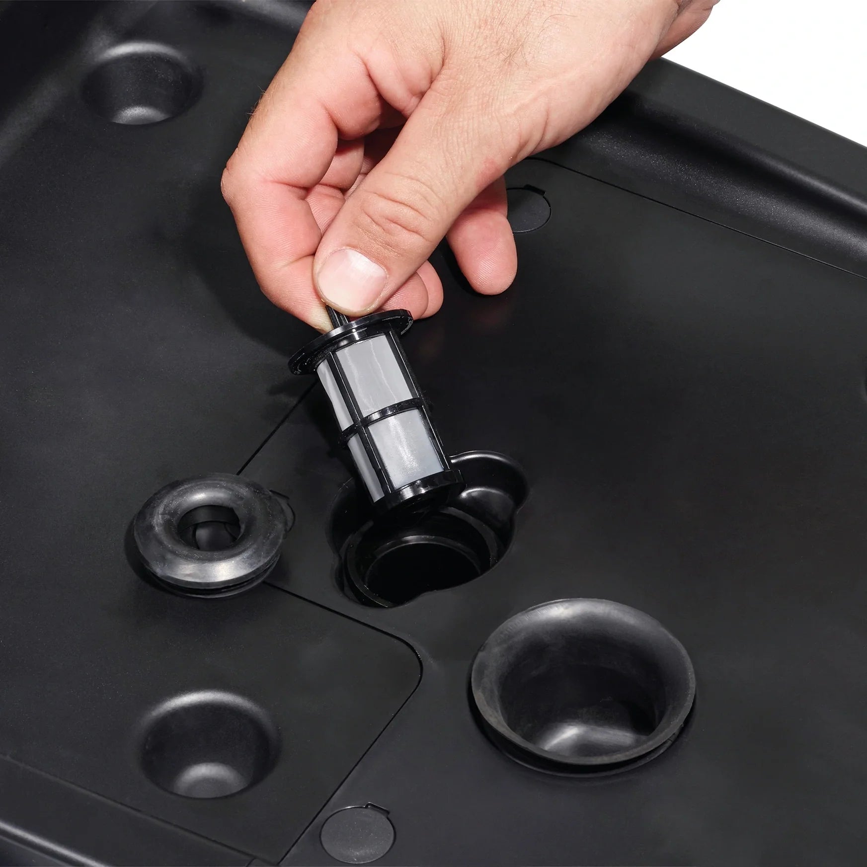 Solution filter of the Clarke MA30 13B being removed for cleaning