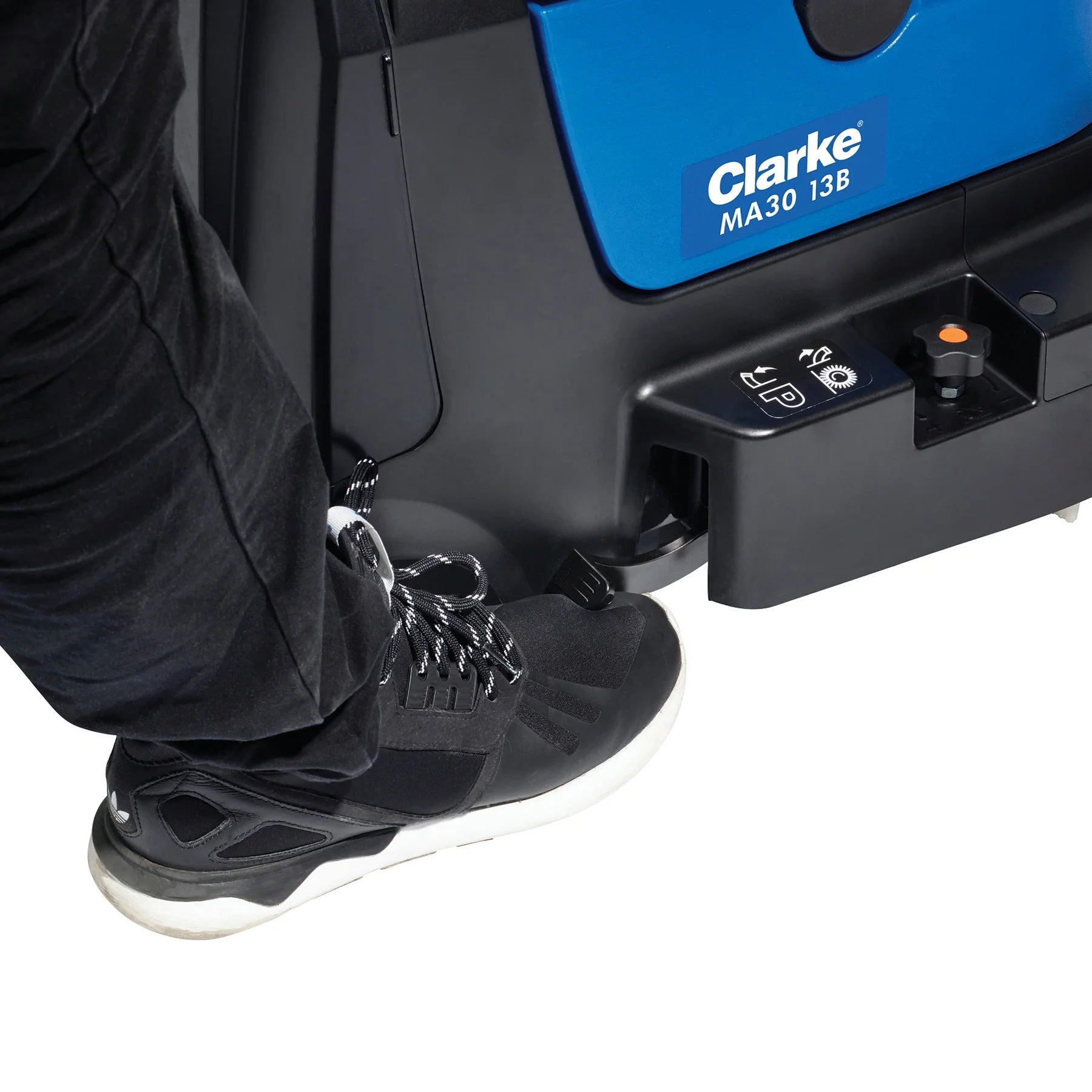 Foot on the parking pedal of the Clarke MA30 13B, setting the brush and squeegees down for scrubbing