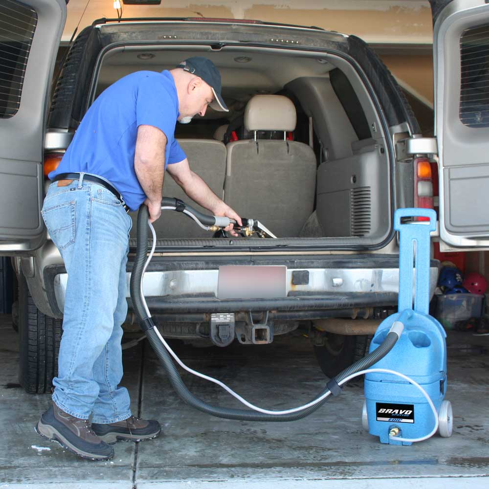 Cleaning car seats with the EDIC stainless upholstery tool on a Bravo spotter