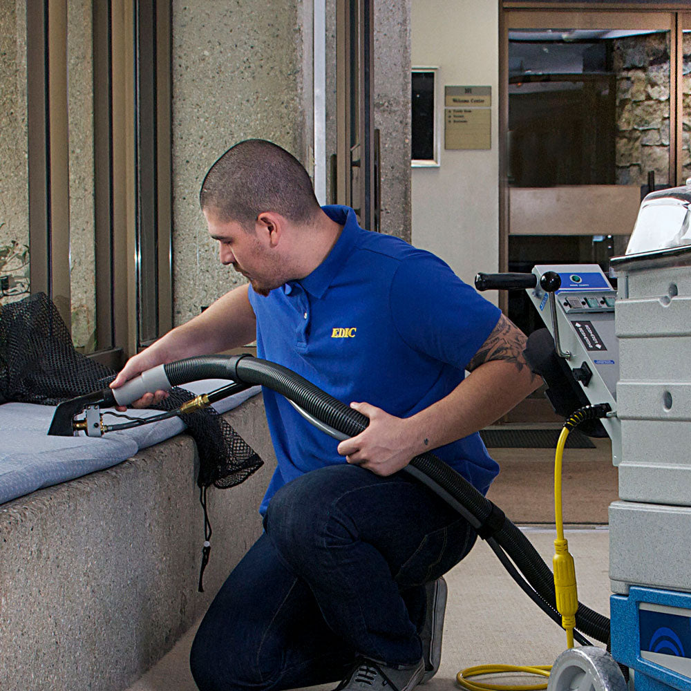 Cleaning a fabric bench with the EDIC 321ACH upholstery tool on a Polaris extractor