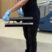 Scrubbing a restroom floor with the EDIC dual head wand on a CR2
