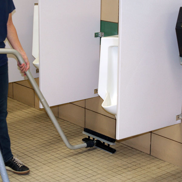 Vacuuming a restroom floor dry with the EDIC dual head squeegee wand and CR2