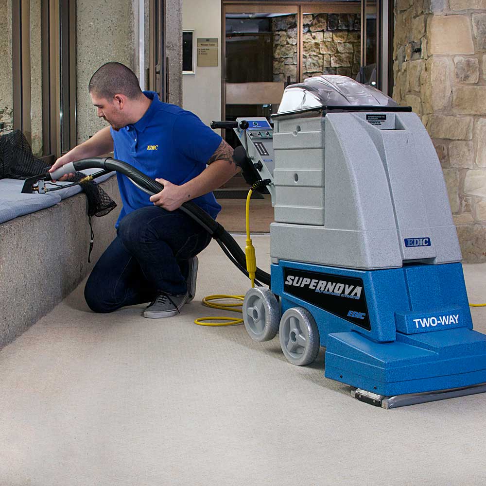 EDIC Supernova cleaning upholstery with the hose and upholstery tool