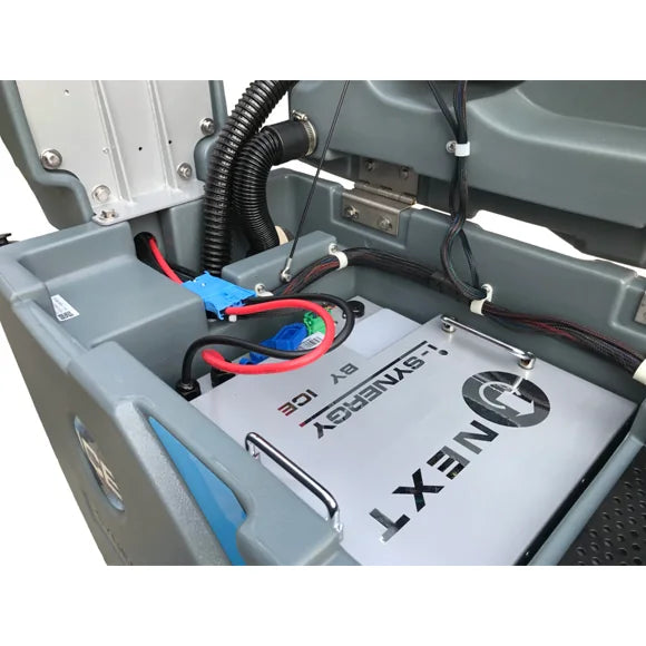 Open battery compartment of an ICE walk-behind scrubber with the i-Synergy lithium battery connected