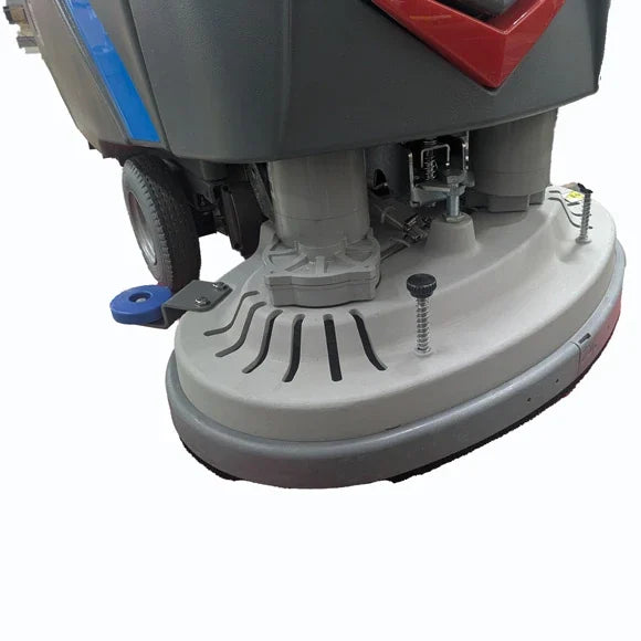 Close-up of an ICE i28BTL+ pad driver on the dual-disc scrub deck