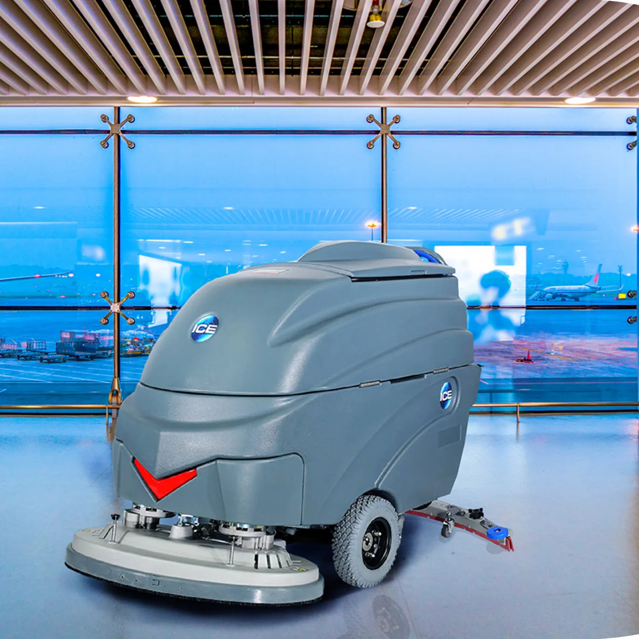 ICE i36BT walk-behind floor scrubber on a polished airport terminal floor
