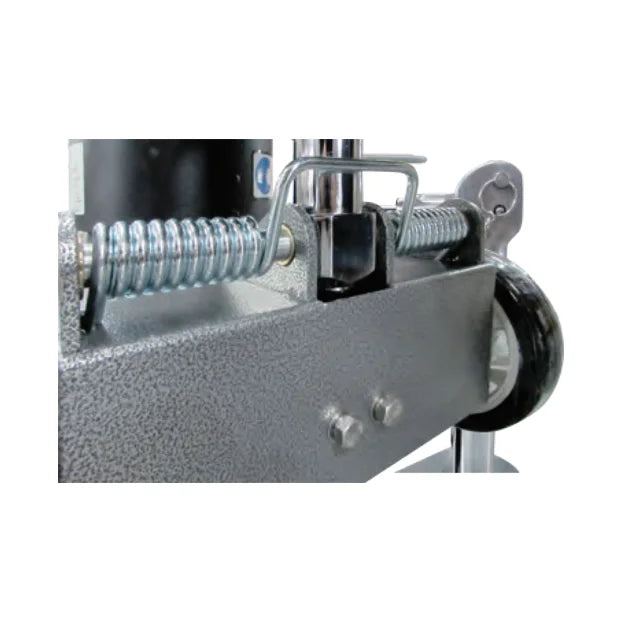Close-up of the twist spring and leveling rod on the ICE iB1500 frame that set the pad pressure, next to a rear wheel