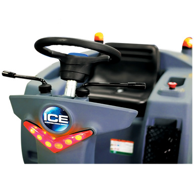 Front three-quarter view of the ICE iS1100L+ ride-on sweeper showing the steering wheel, seat, beacon light and front LED lights