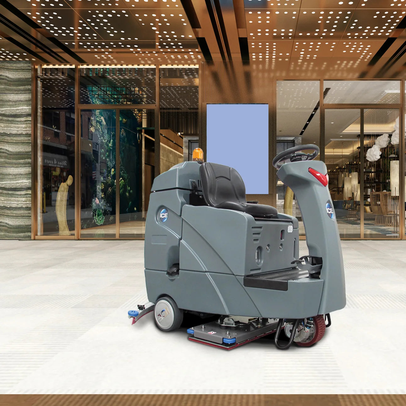 ICE RS28-OB orbital ride-on scrubber cleaning the polished floor of a shopping mall lobby in front of glass storefronts