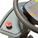 Close-up of the red emergency stop button on the dash of an ICE rider scrubber