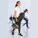 Operator carrying the 37.5 lb NaceCare 220NX by hand through a busy concourse