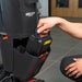 Hand lifting the NX300 lithium battery out of its slot on the NaceCare 220NX by the carry handle