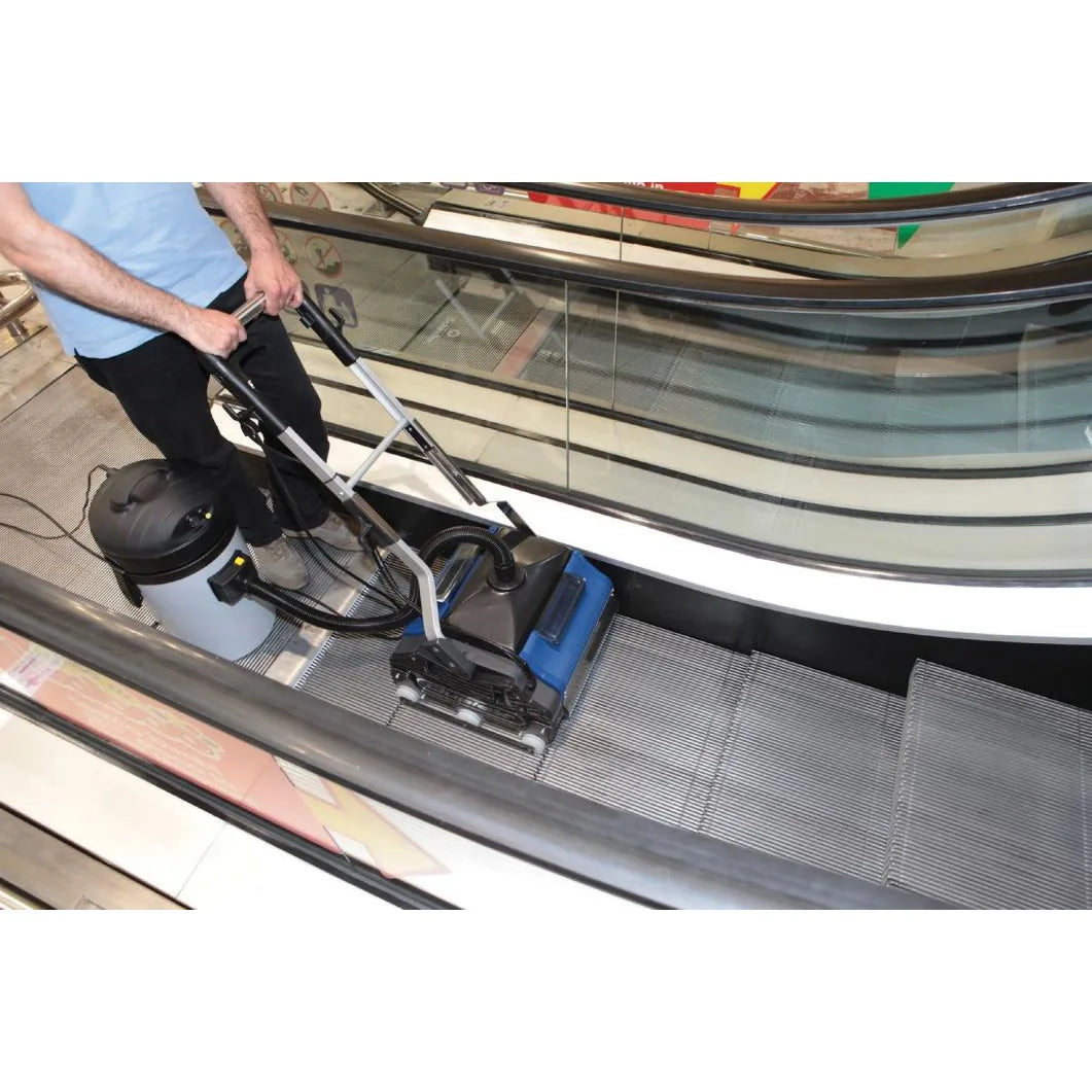 Operator cleaning escalator steps with a Duplex 420 and escalator kit