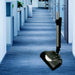 NaceCare 13-inch battery power head vacuuming carpet in an office corridor